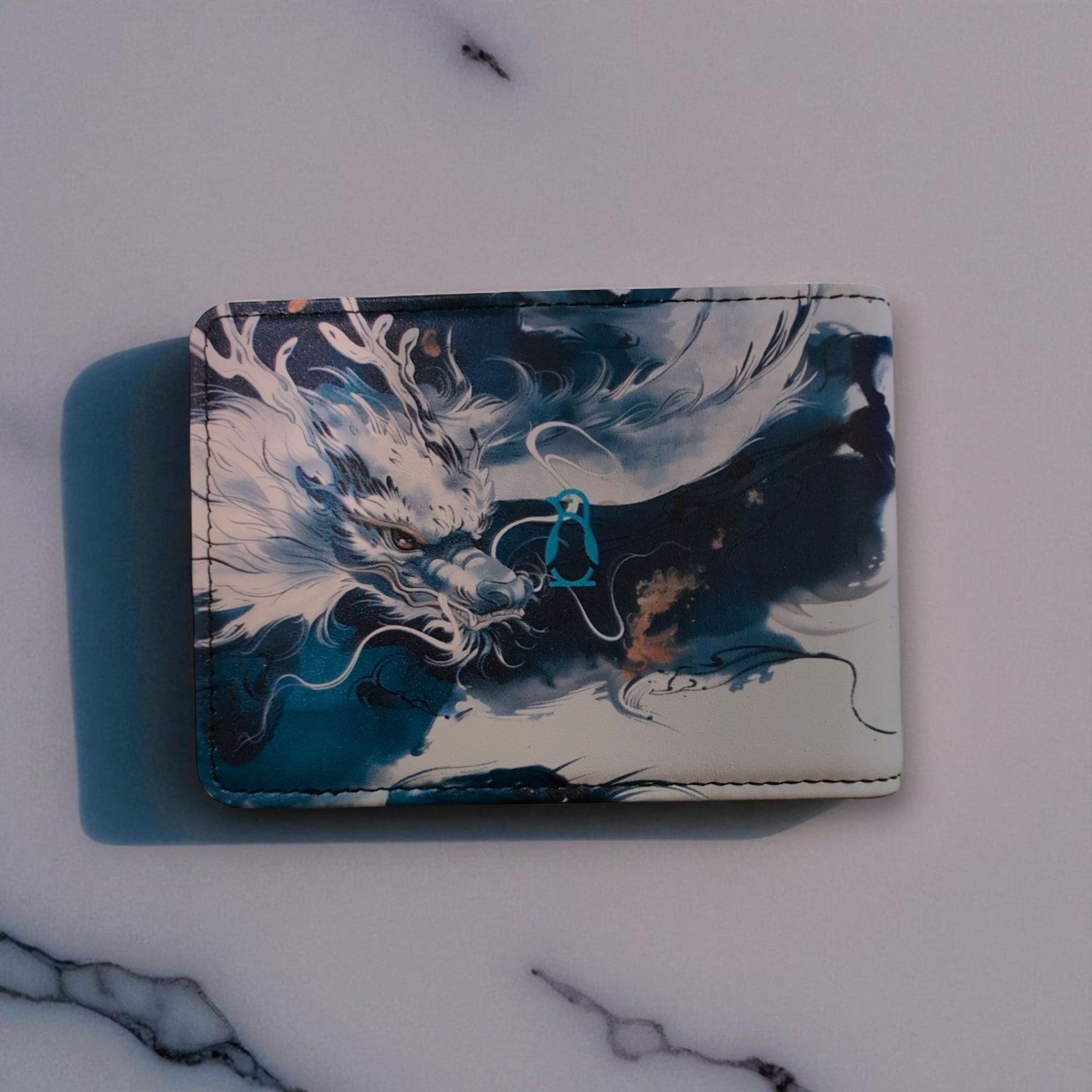 Cardholder with dragon design on a marble surface